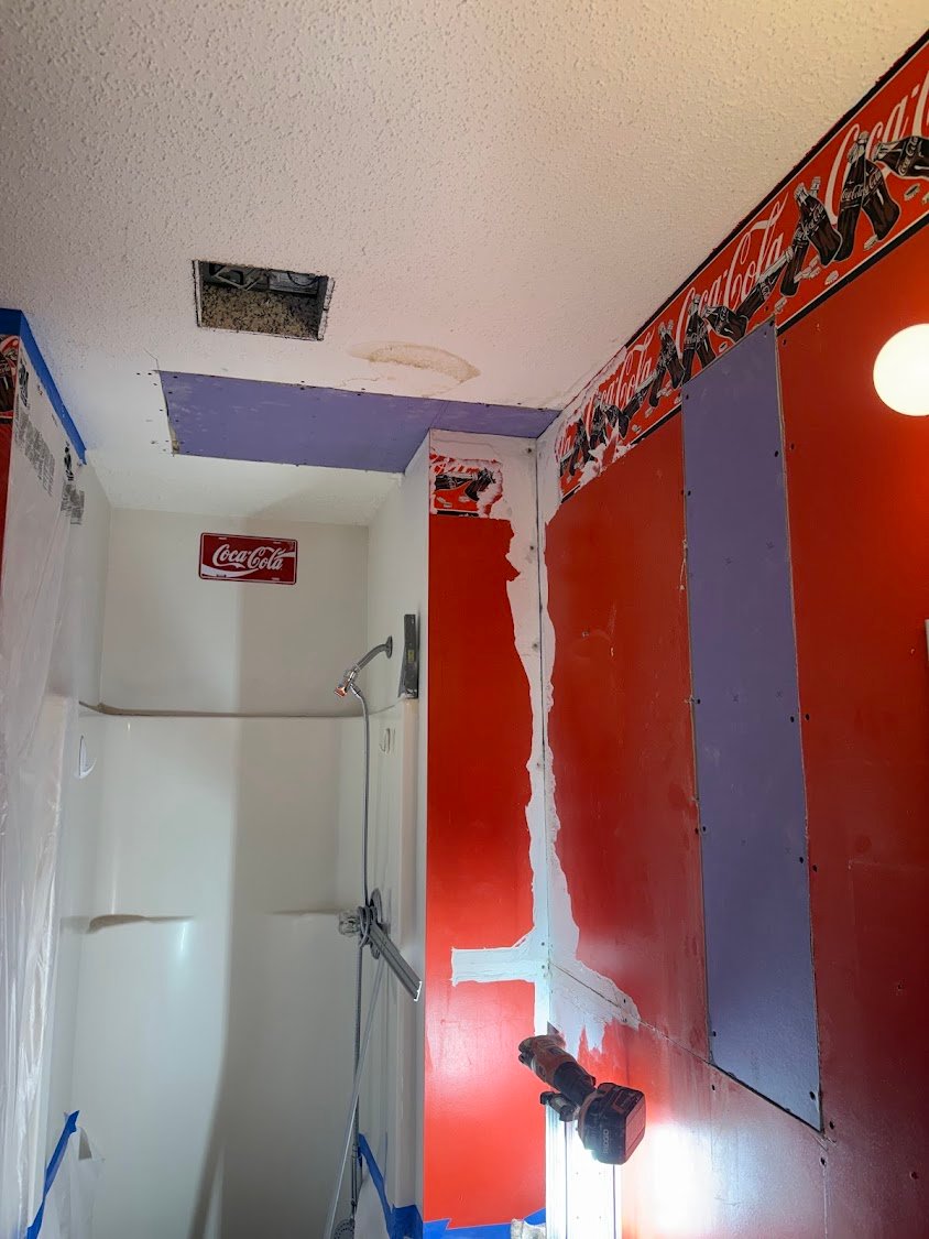 Wall access cut before plumbing post-trade repair